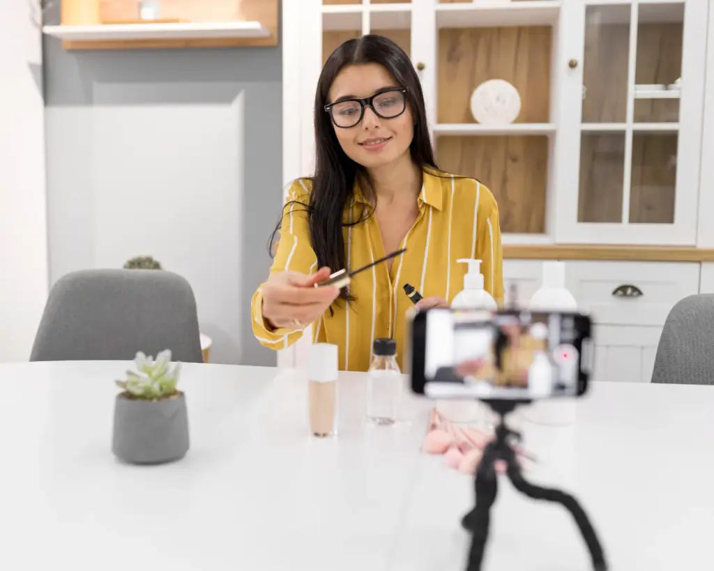 Beauty influencer filming a product review at home, illustrating strategies to choose the right influencer for your brand.
